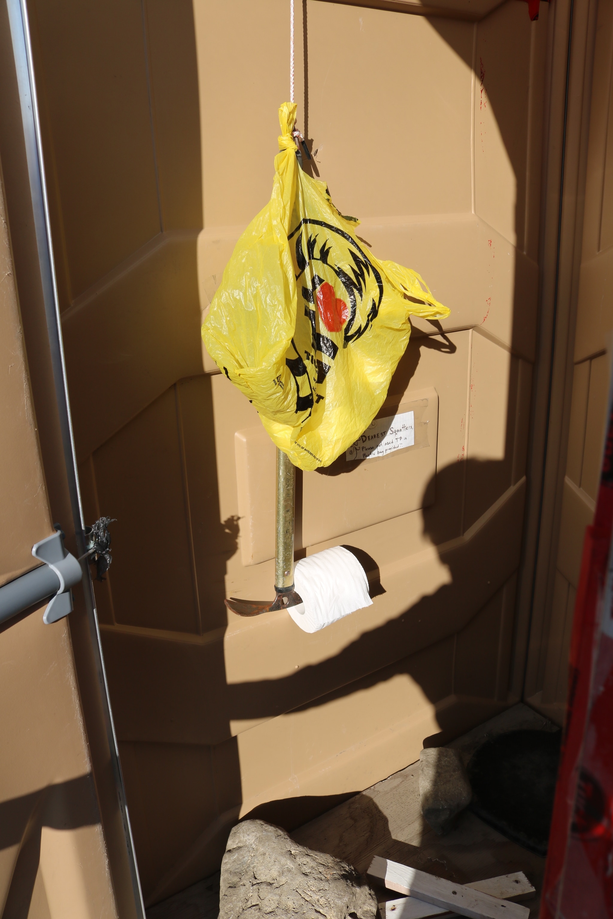 In this remote researcher's paradise, Axel Heiberg Island in the Canadian High Arctic, the team's outhouse is equipped with an ice axe toilet paper holder.