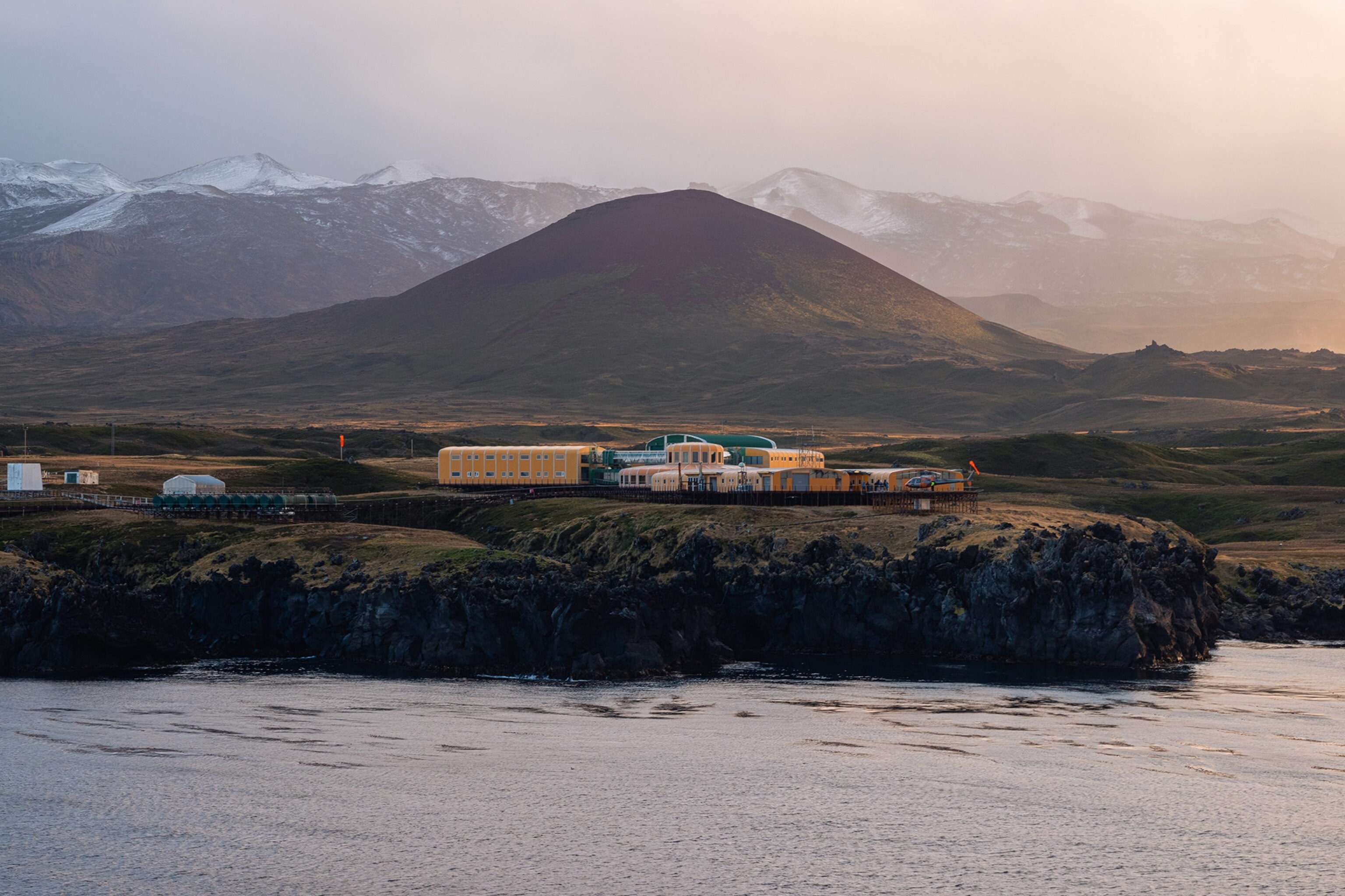 Marion Island is a South African research base located in the sub-Antarctic. The island is uniquely radio quiet for astronomical observations. Chiang’s radio telescope installations are sited behind the central hill in the photo, a few kilometers away from the research base that is visible in the foreground.